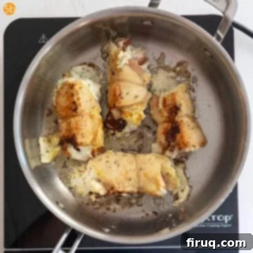 Chicken Rollatini 9 Chicken flipped and golden brown on one side while being fried.