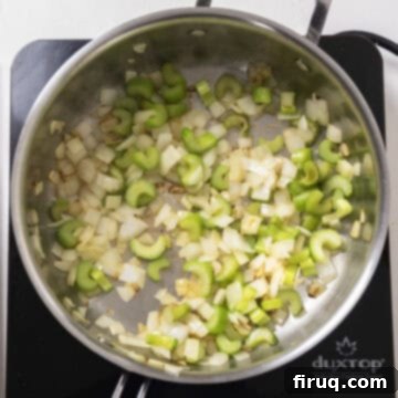 Gourmet Italian Sausage Stuffed Mushrooms 4 Sauteed celery and onion in a pan.