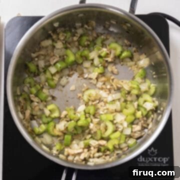 Gourmet Italian Sausage Stuffed Mushrooms 5 Sauteed celery, onion, and mushroom stems in a pan.