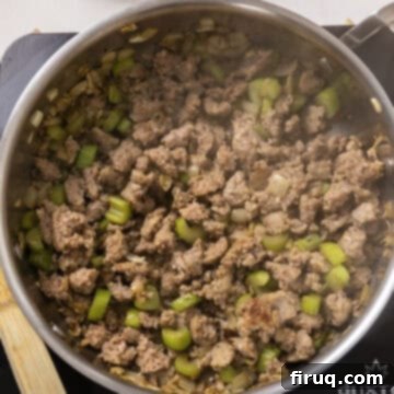 Gourmet Italian Sausage Stuffed Mushrooms 6 Browning sausage with vegetables.