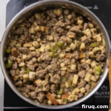 Gourmet Italian Sausage Stuffed Mushrooms 7 Stuffing cubes and chicken broth combined with brown sausage in a pan.