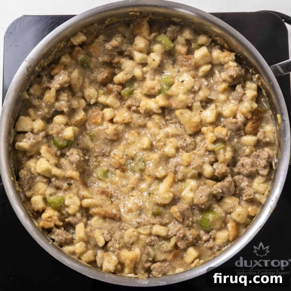 Gourmet Italian Sausage Stuffed Mushrooms 8 Stuffing in a saucepan with sausage and bread stuffing.