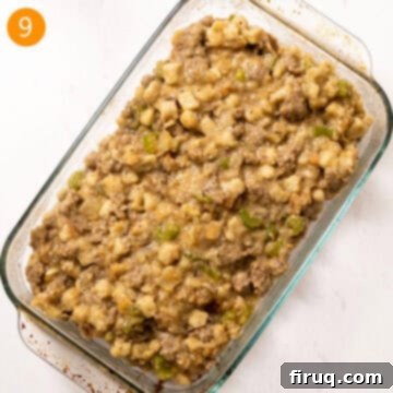 Robust Italian Sausage Thanksgiving Stuffing 10 Prepared Italian sausage stuffing spread evenly in a 9x13 inch glass baking dish, ready to be baked in the oven until golden brown.
