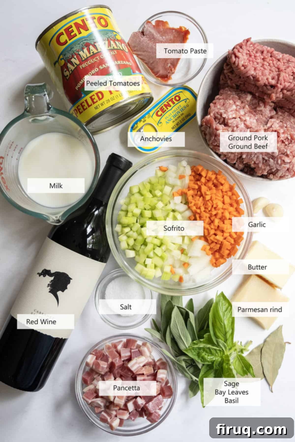 Classic Bolognese Ragù 3 Collection of fresh ingredients for authentic bolognese including meats, vegetables, and herbs.
