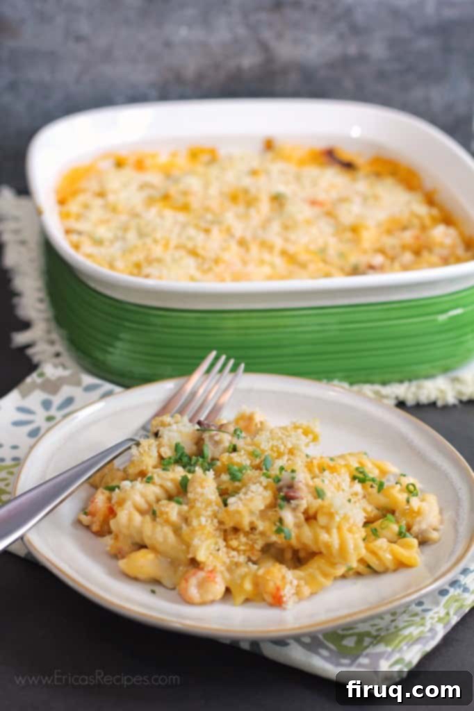 The Ultimate Florida Lobster Gratin 5 A serving of Florida Lobster Gratin on a plate, garnished with fresh chives