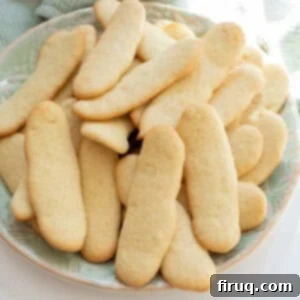 Homemade Ladyfingers for Perfect Tiramisu 11 A bunch of fluffy homemade ladyfingers on a plate, ready for Tiramisu.