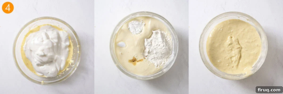 Homemade Ladyfingers for Perfect Tiramisu 7 A spatula gently folding beaten egg whites into the pale egg yolk mixture, along with vanilla, cornstarch, flour, and salt, creating a delicate, custardy batter.