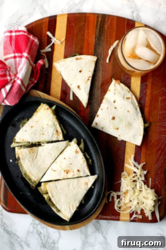 Vegetarian Poblano Quesadillas Another enticing view of a Rajas con Crema Quesadilla, showcasing the golden tortilla and the creamy, cheesy filling, garnished with fresh herbs.