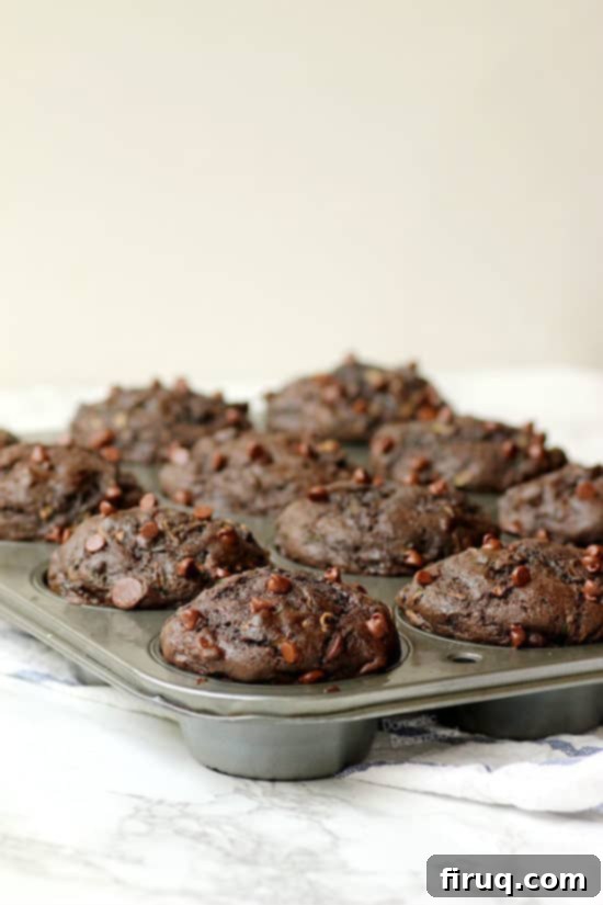 Healthier Double Chocolate Zucchini Muffins with hidden veggies Double Chocolate Zucchini Muffins - Domestic Dreamboat #chocolate #healthier