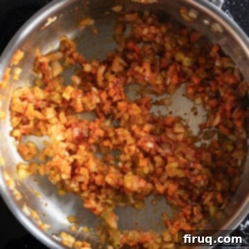 Rustic Italian Lentils 6 Tomato paste combined with vegetables in saucepan.