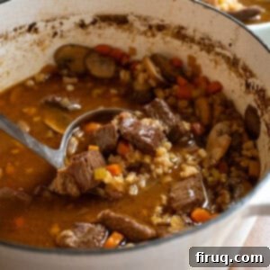 Hearty Beef Barley and Mushroom Soup 11 Beef and barley soup in a pot.