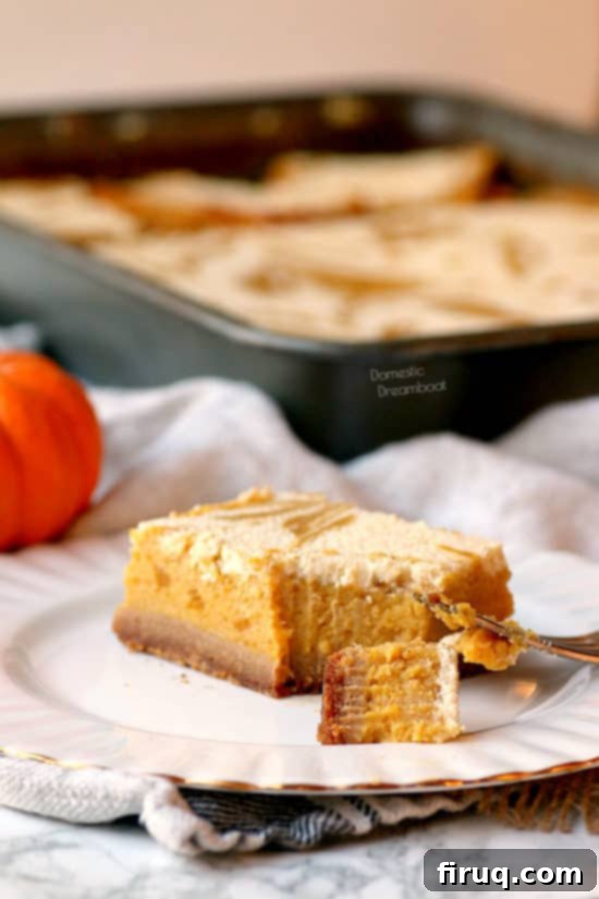 Spiced Pumpkin Cheesecake Marbled Bars 4 Pumpkin Pie Cheesecake Swirl Bars - Domestic Dreamboat #dessert #pumpkinpie #Thanksgiving