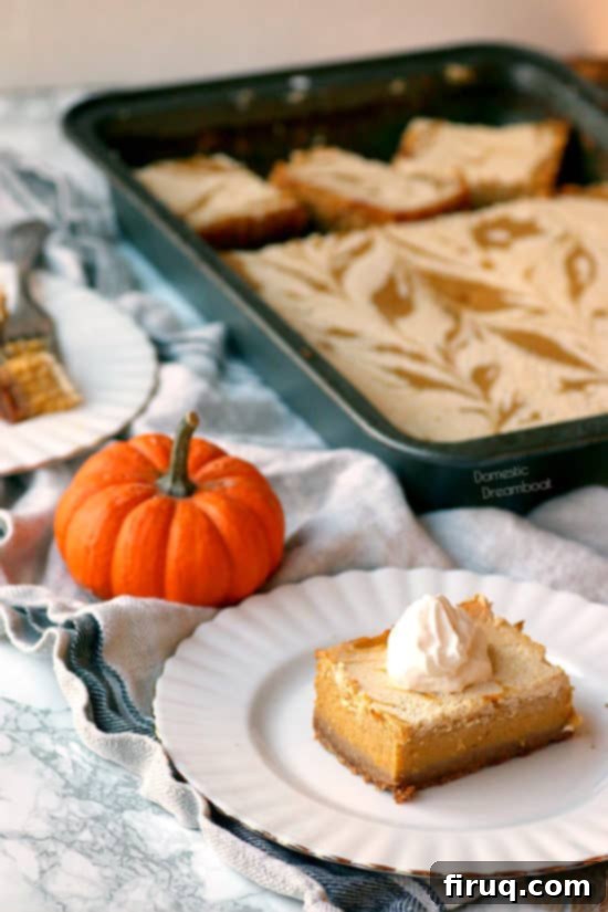 Spiced Pumpkin Cheesecake Marbled Bars 6 Pumpkin Pie Cheesecake Swirl Bars - Domestic Dreamboat #dessert #pumpkinpie #Thanksgiving