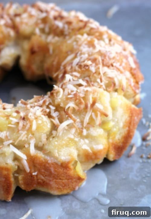 Tropical Pina Colada Pull-Apart Bread 7 Side view of the delectable Pina Colada Monkey Bread, beautifully topped with golden toasted coconut flakes.