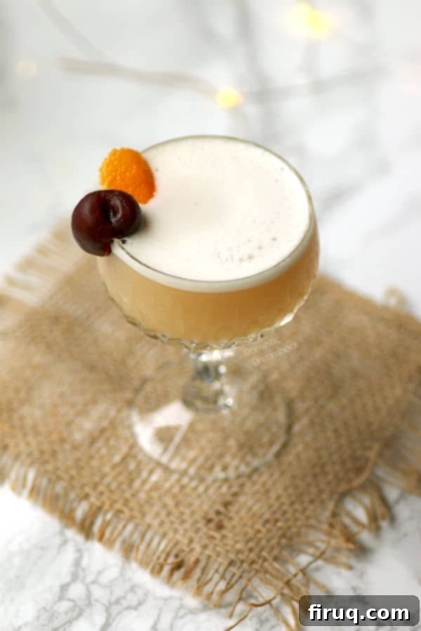 Aquafaba Amaretto Sour Amaretto Sour with a light, airy aquafaba foam.