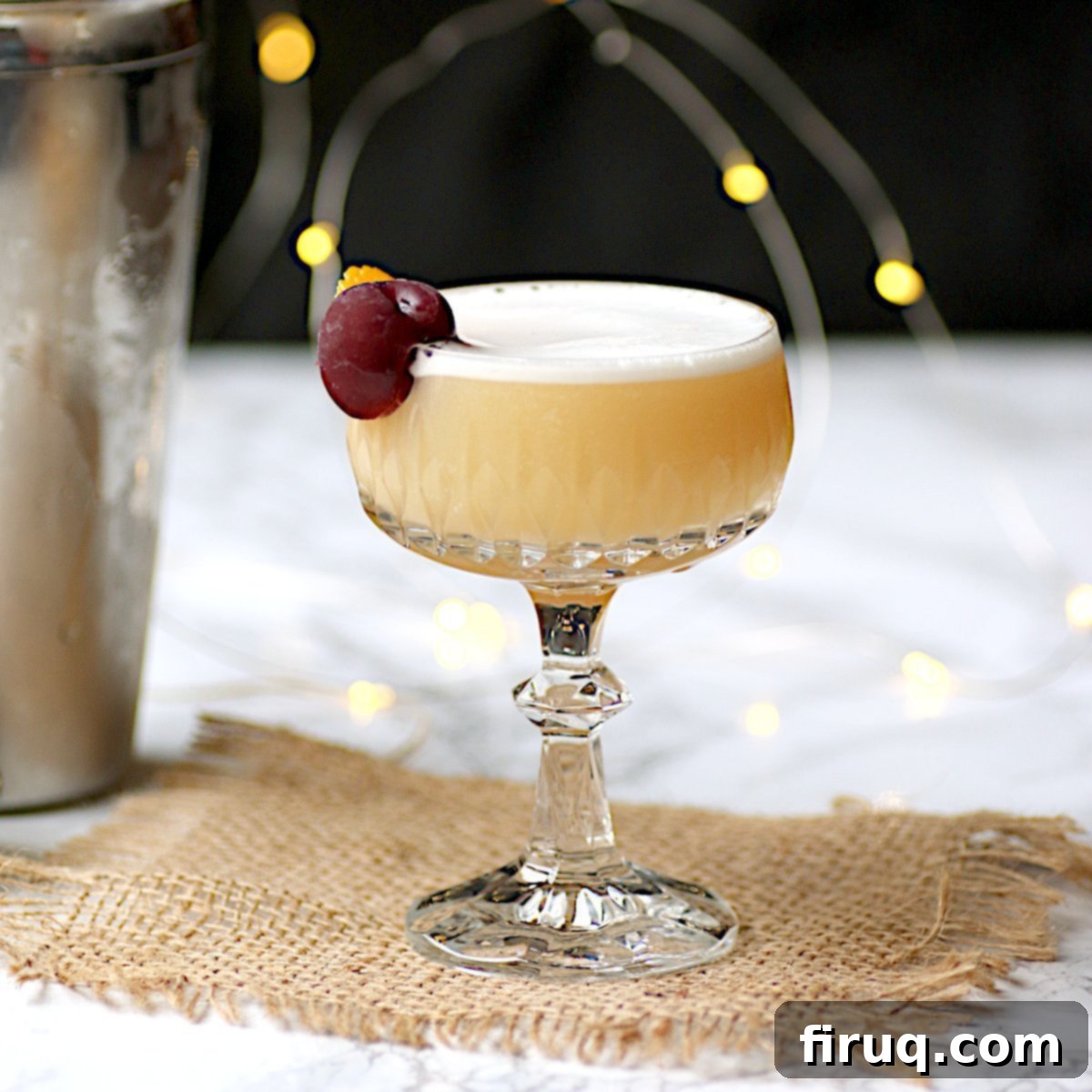 Classic Amaretto Sour Amaretto sour cocktail in a crystal glass
