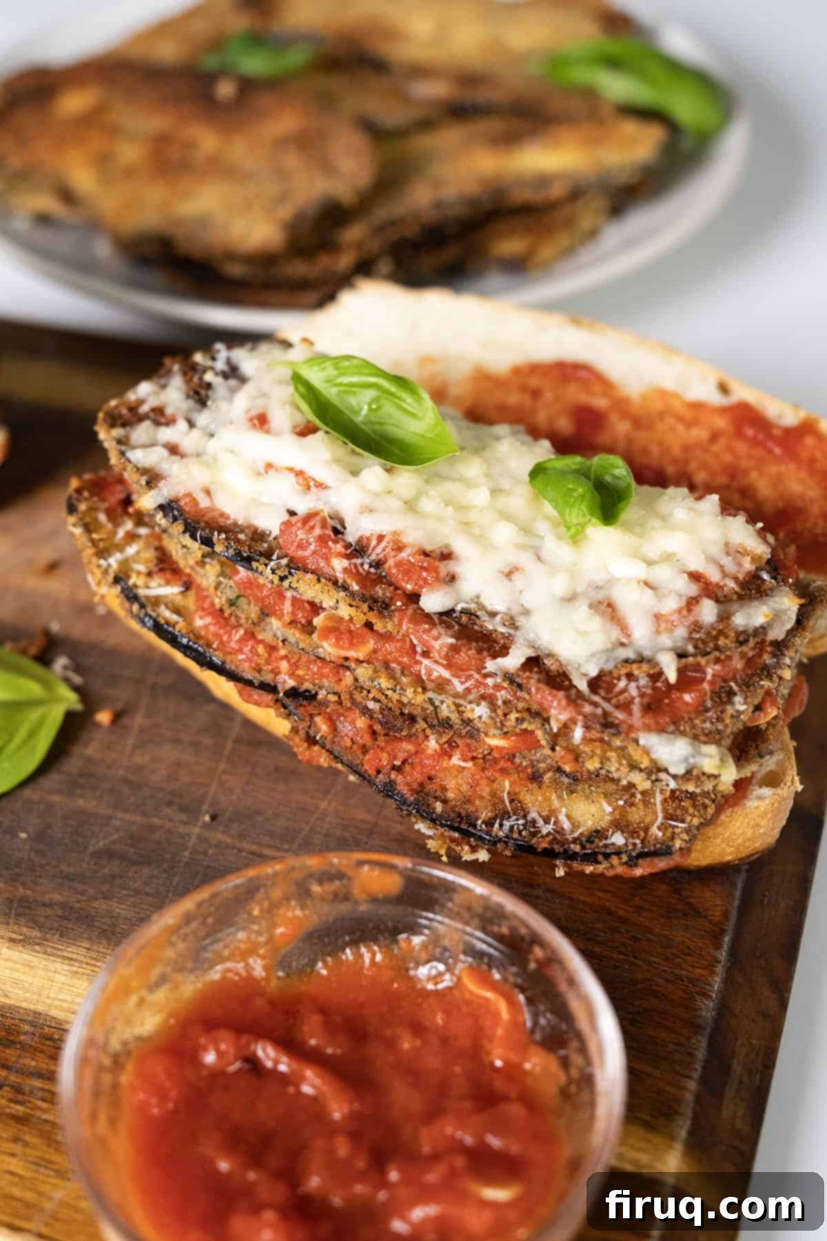 Eggplant Parmesan Sandwich 11 Eggplant topped with marinara, parmesan, and mozzarella on a roll.