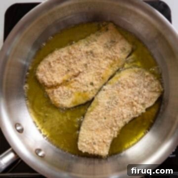 Eggplant Parmesan Sandwich 7 Frying eggplant in a saucepan.