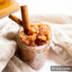 Fireside Apple Relish 11 Spiced apple chutney in a mason jar garnished with cinnamon sticks.