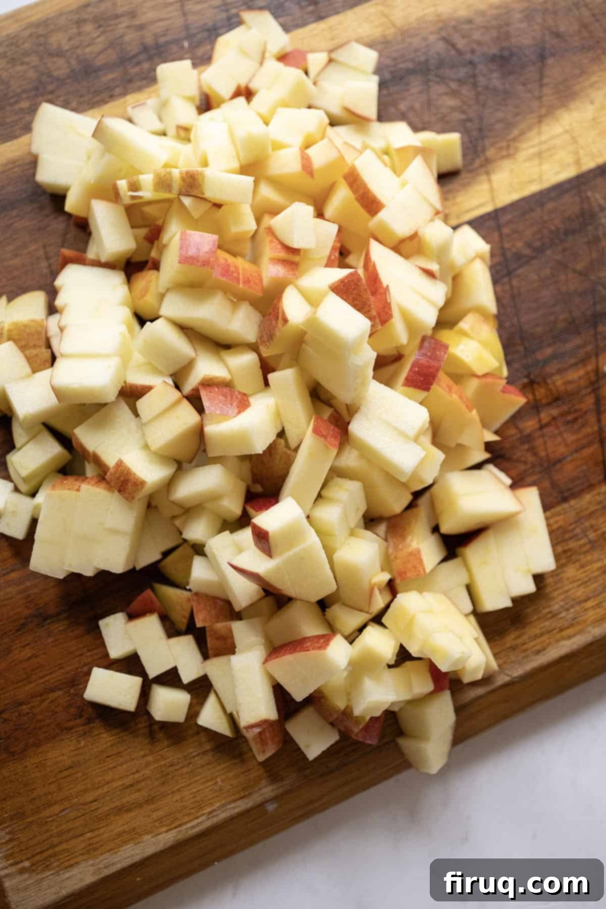 Fireside Apple Relish 4 Apples chopped on a cutting board.