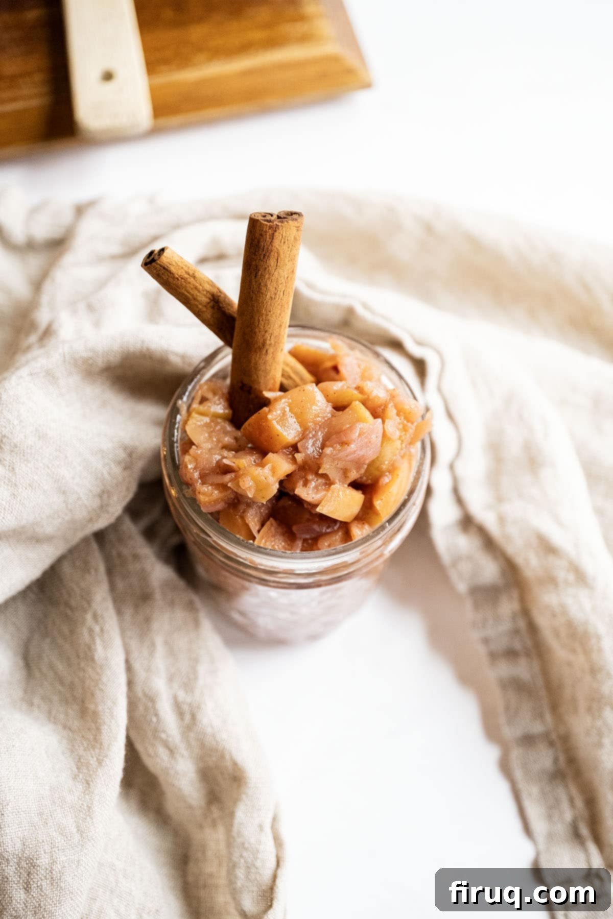Fireside Apple Relish 10 Spiced apple chutney in a mason jar garnished with cinnamon sticks.