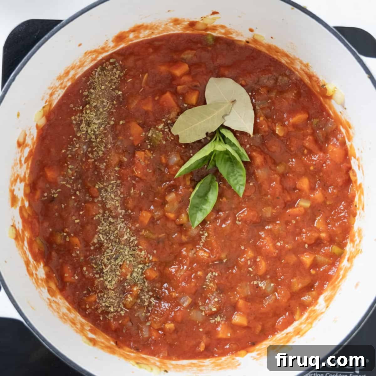 Hearty Italian Pasta and Bean Soup 7 Crushed tomatoes, seasoning, basil, and bay leaves added to the vegetables.