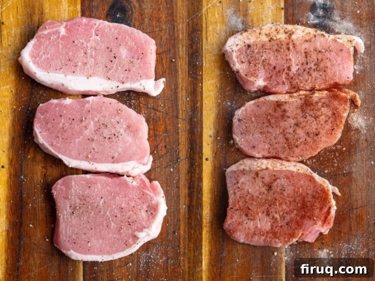 Crispy, Juicy Cast Iron Boneless Pork Chops 5 Seasoning pork chops on a cutting board.