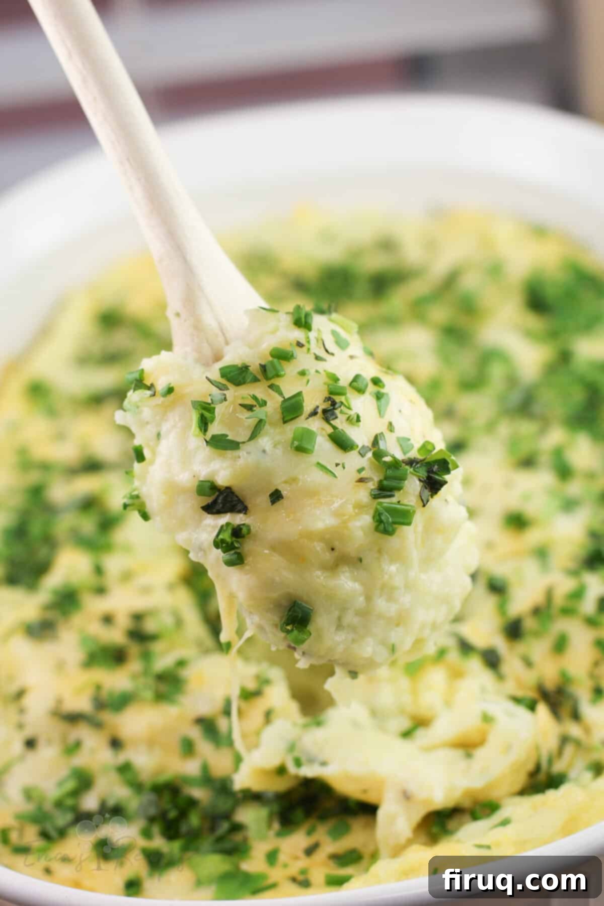 Garlicky Gruyere and Gouda Mashed Potatoes 3 wood spoon holding gruyere and gouda mashed potatoes