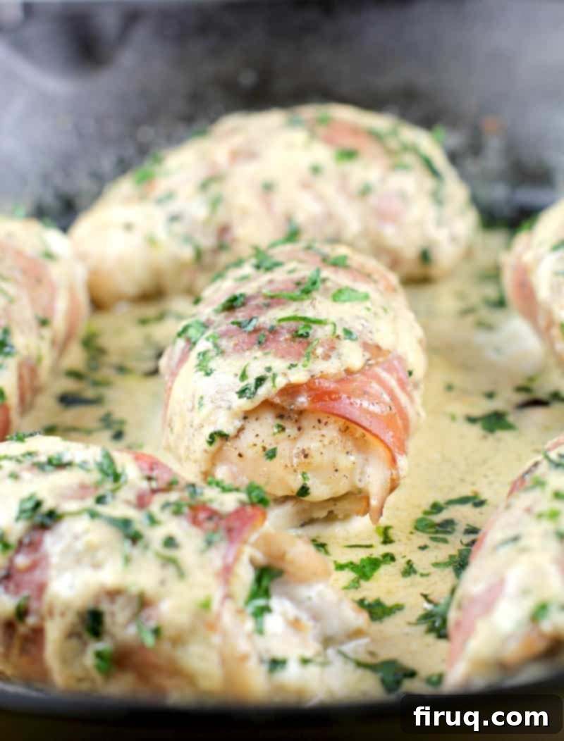 Gourmet Prosciutto-Wrapped Boursin Chicken 3 prosciutto-wrapped chicken in pan