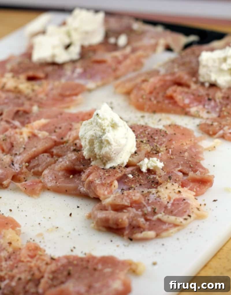 Gourmet Prosciutto-Wrapped Boursin Chicken 6 boursin cheese piece on a flat chicken thighs