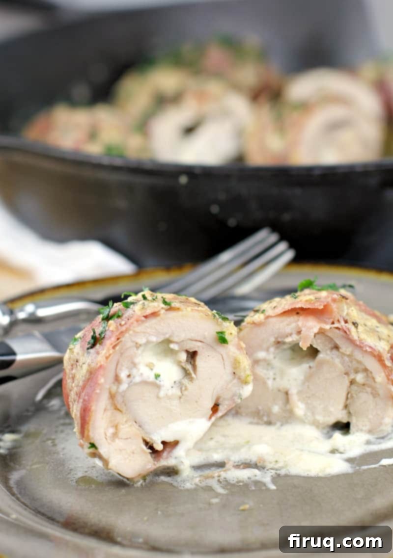 Gourmet Prosciutto-Wrapped Boursin Chicken 10 serving plate with chicken cut to show boursin inside