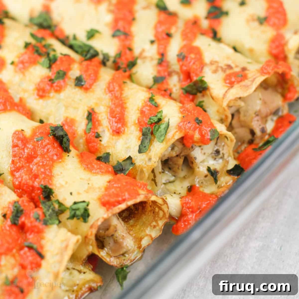 Savory Pesto Chicken Crepes 2 pesto chicken crepes in glass bake dish