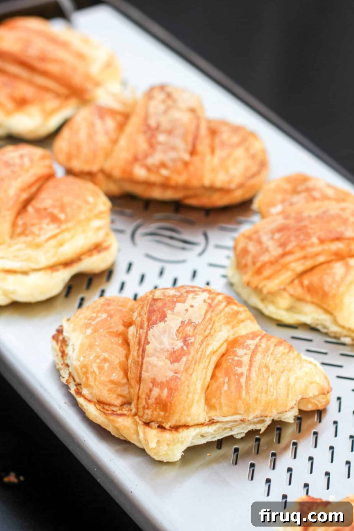 Blackstone Croissant Breakfast Melts 6 close view of croissants sitting on Blackstone warmer rack