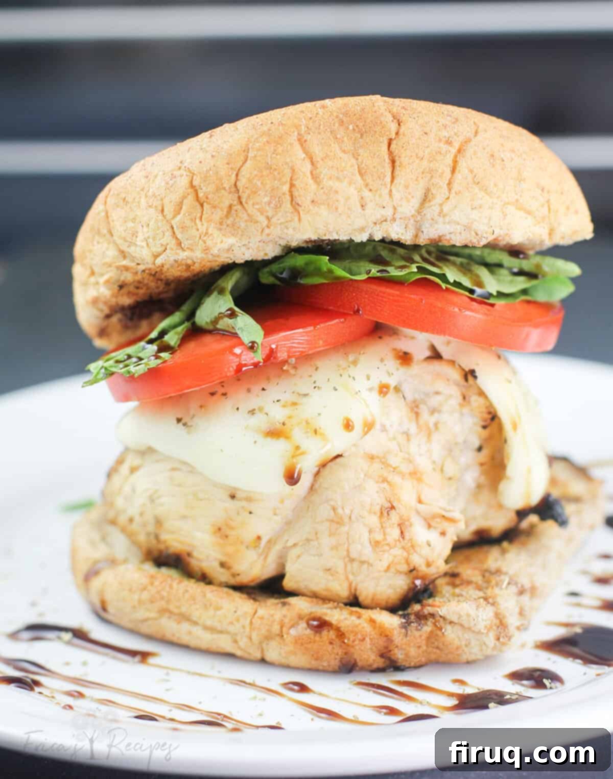 Grilled Chicken Caprese Sandwich 7 side view of prepared recipe on white plate
