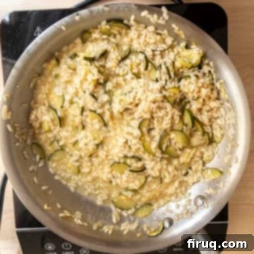 Creamy Zucchini Risotto 11 Creamy zucchini risotto tossed with parmesan, showing the desired loose, flowing texture.