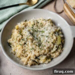 Creamy Zucchini Risotto 13 Zucchini risotto in a bowl topped with parmigiano and parsley.