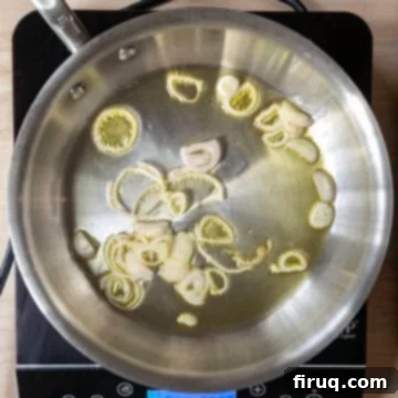 Creamy Zucchini Risotto 4 Shallots gently sauteing in a large saucepan, becoming translucent.