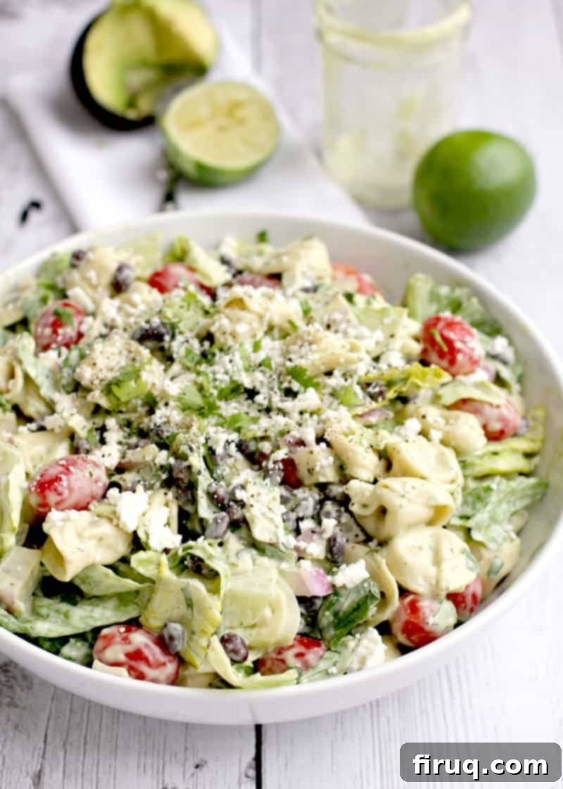 Creamy Avocado Tortellini Salad 4 The complete and beautifully assembled tortellini salad with avocado dressing in a large elegant white serving bowl, showcasing its vibrant colors and rich textures