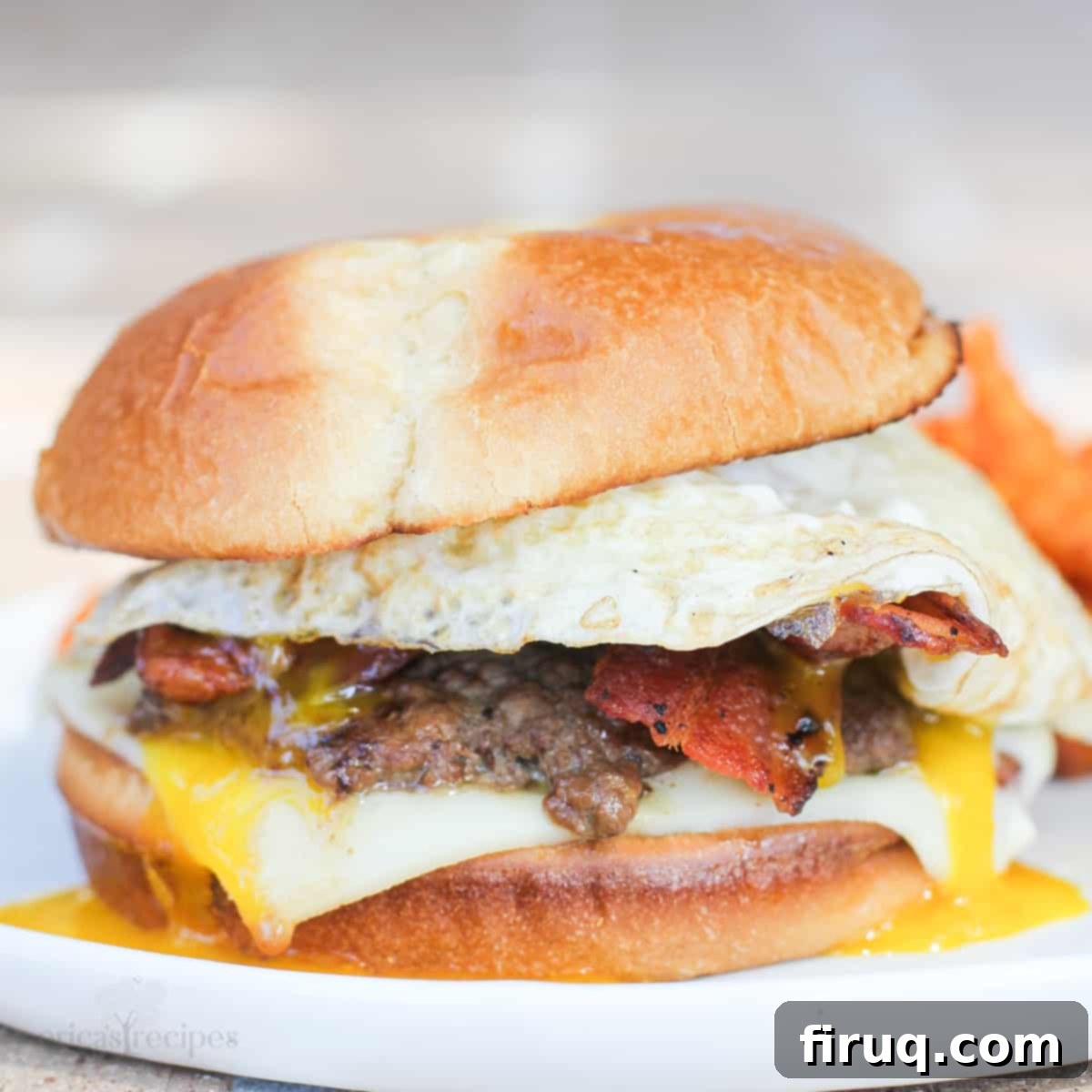 The Morning After Burger 9 bacon and egg burger on white dish