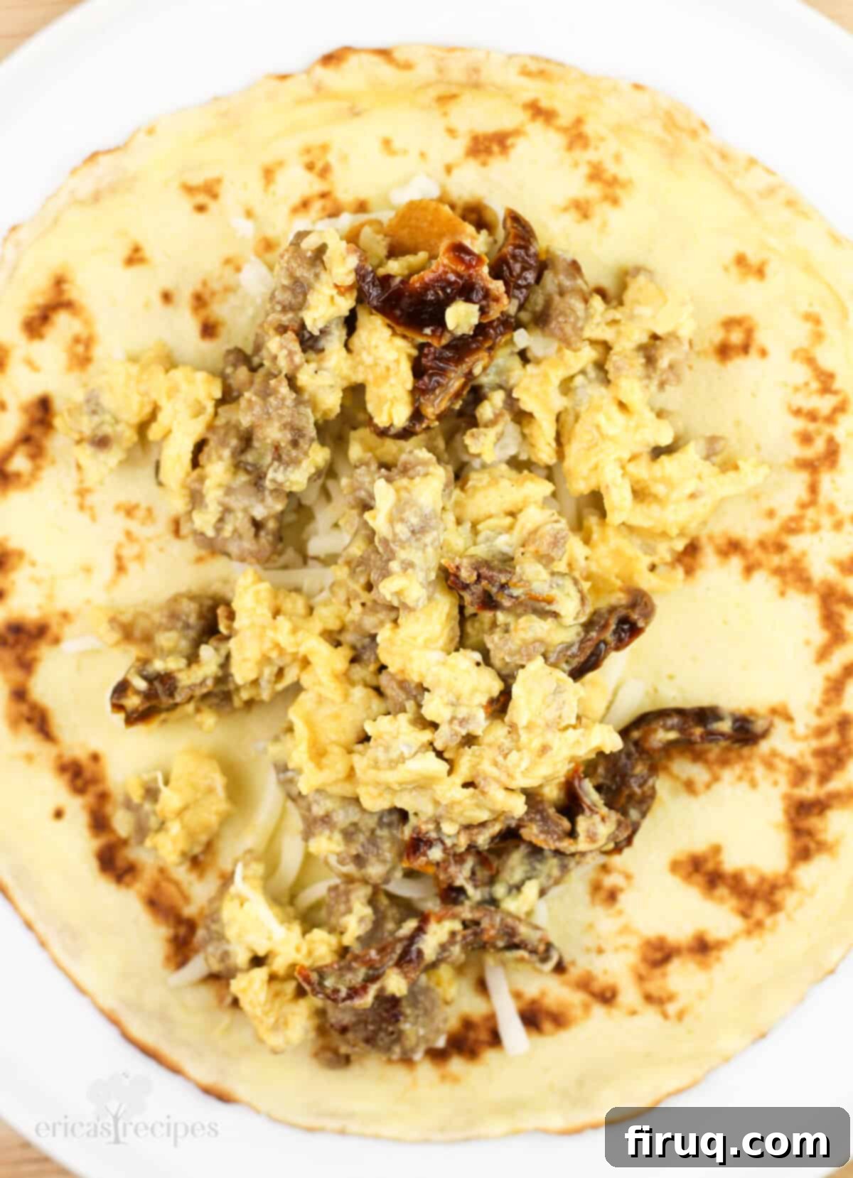 Sweet & Savory Sausage Crepes with Maple Béchamel 7 egg and sausage crepe filling on open crepe