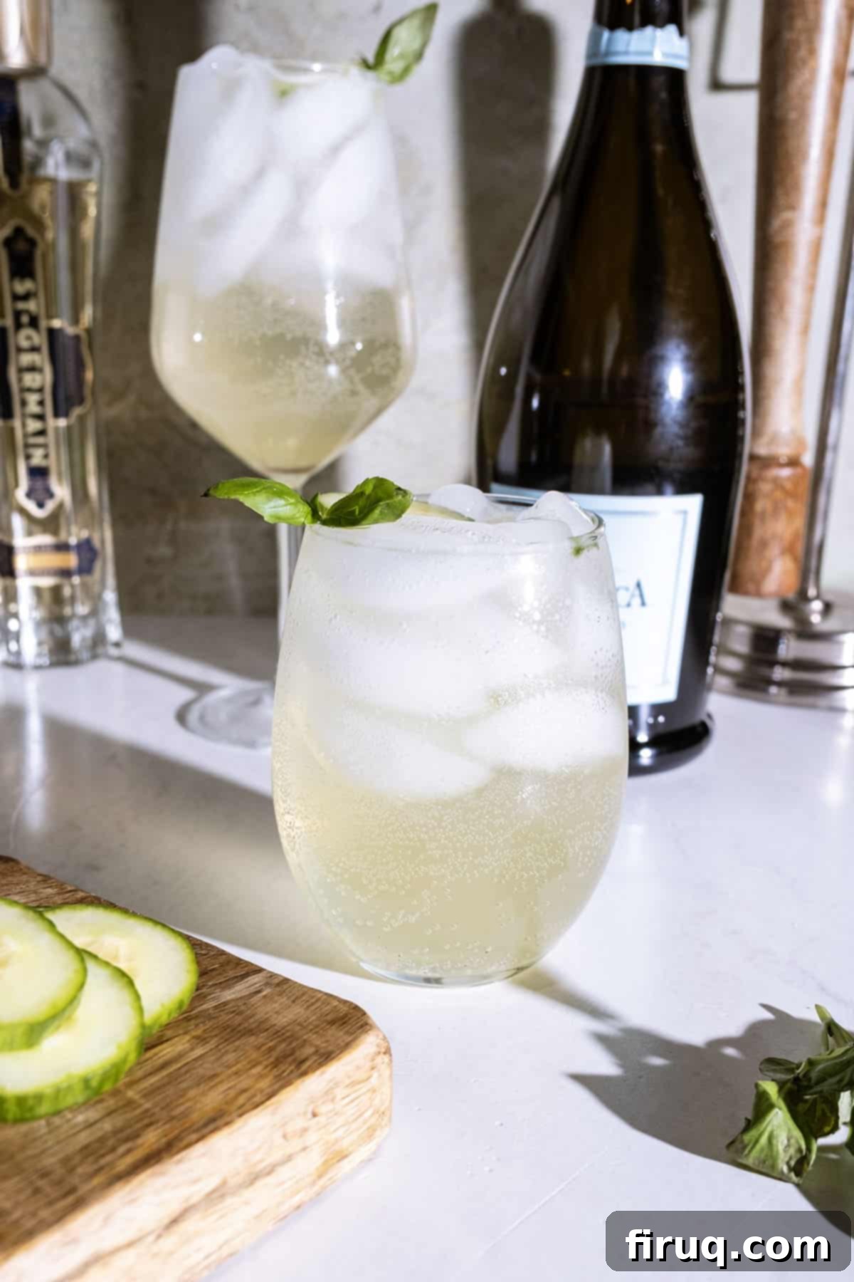 St Germain Basil Cucumber Cooler 4 St germain spritz with cucumber and basil garnish.