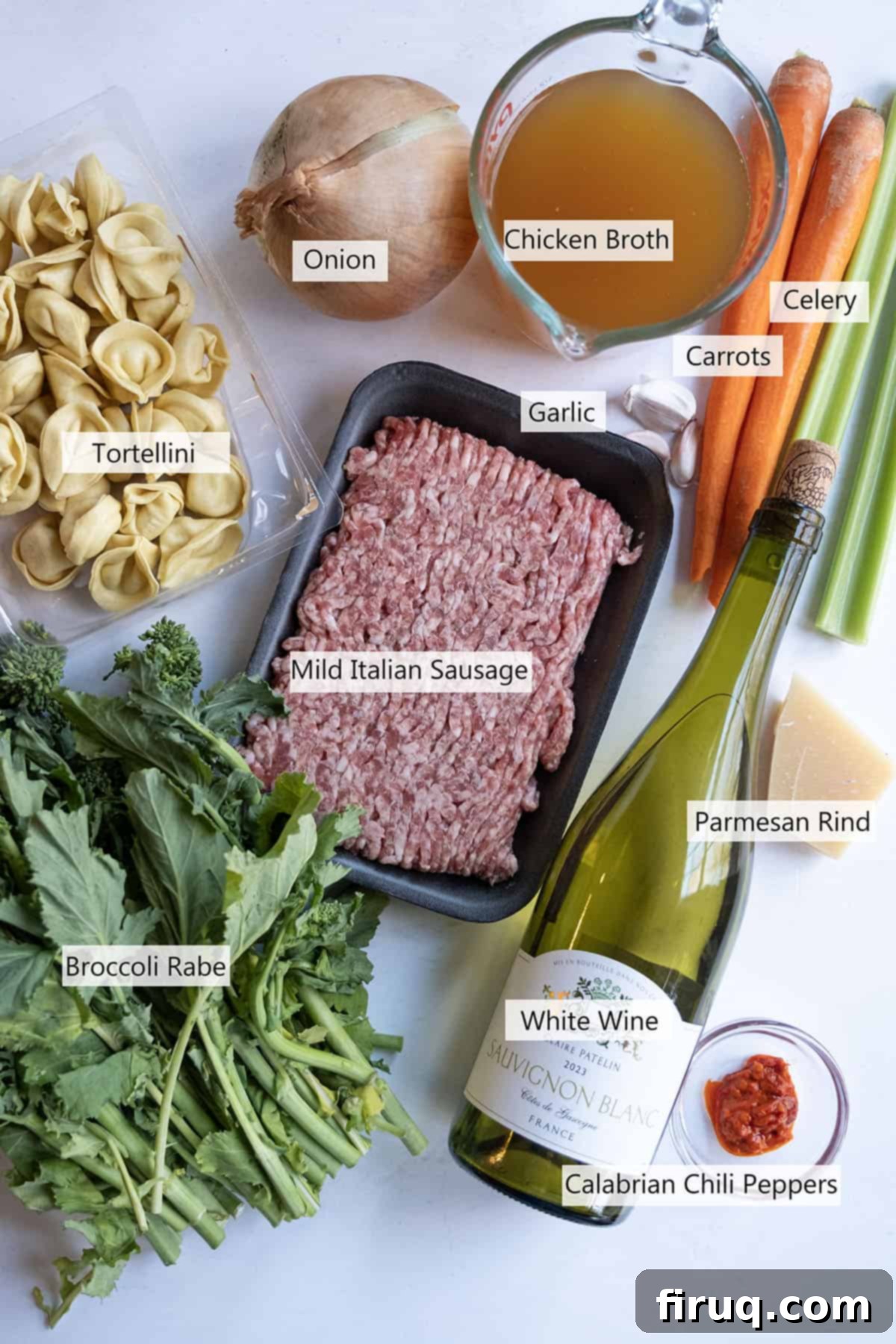 Savory Broccoli Rabe & Tortellini Bowl 3 A collection of fresh ingredients laid out for the Broccoli Rabe and Tortellini Soup recipe, including sausage, tortellini, broccoli rabe, and vegetables.
