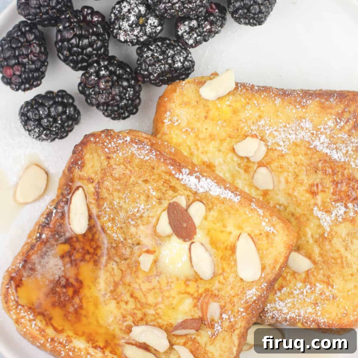 Blackstone Amaretto French Toast 6 Prepared Blackstone Amaretto French Toast on a white plate, served with fresh blackberries, ready to be enjoyed as a gourmet meal.