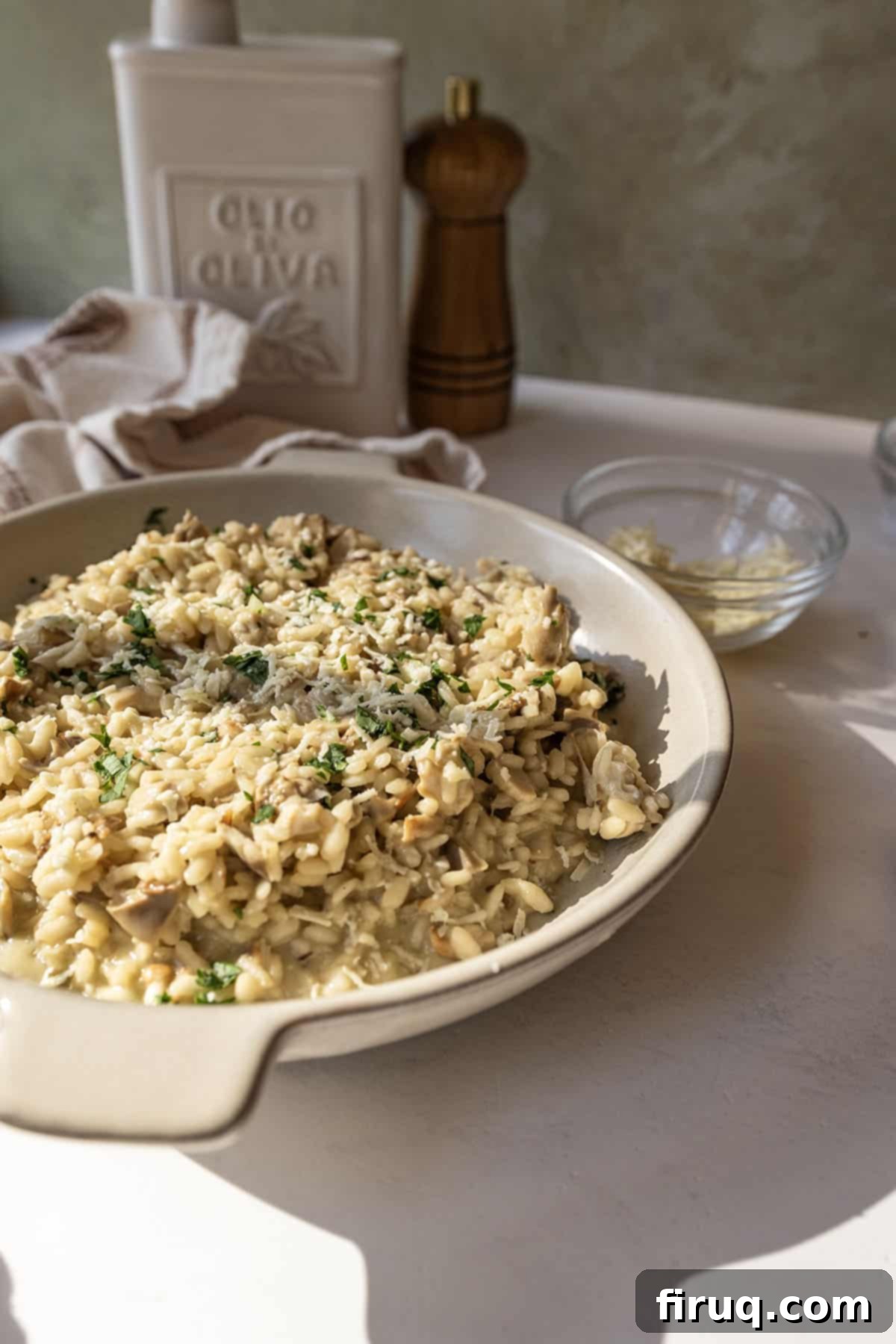 Mushroom Gorgonzola Risotto 2 A bowl of creamy gorgonzola risotto with sautéed mushrooms, topped with extra gorgonzola crumbles and fresh parsley.