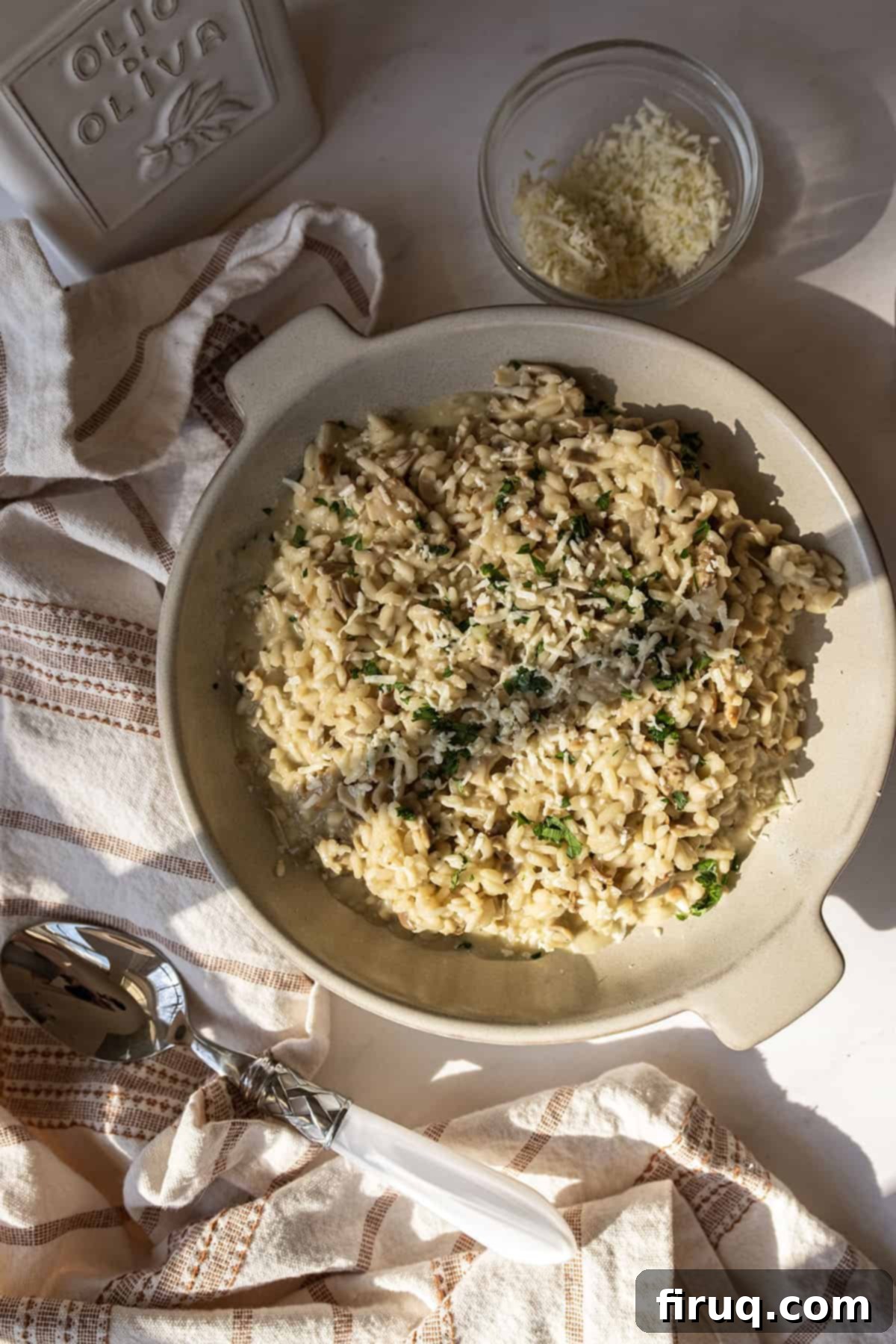 Mushroom Gorgonzola Risotto 12 A beautifully plated bowl of creamy gorgonzola risotto with mushrooms, garnished with fresh parsley and extra gorgonzola.