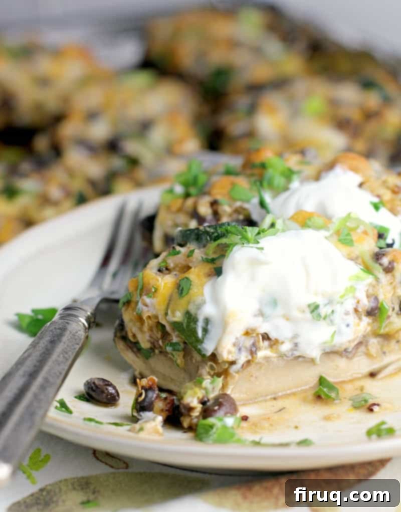 Zesty Mexican Quinoa Portobello Boats 3 plated recipe, sliced to show the layers