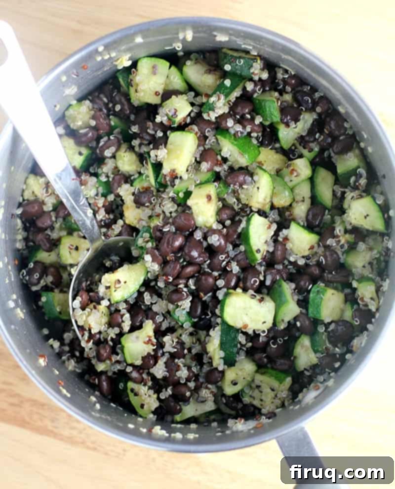 Zesty Mexican Quinoa Portobello Boats 5 top down view into a saucepan of the assembled Mexican quinoa stuffing