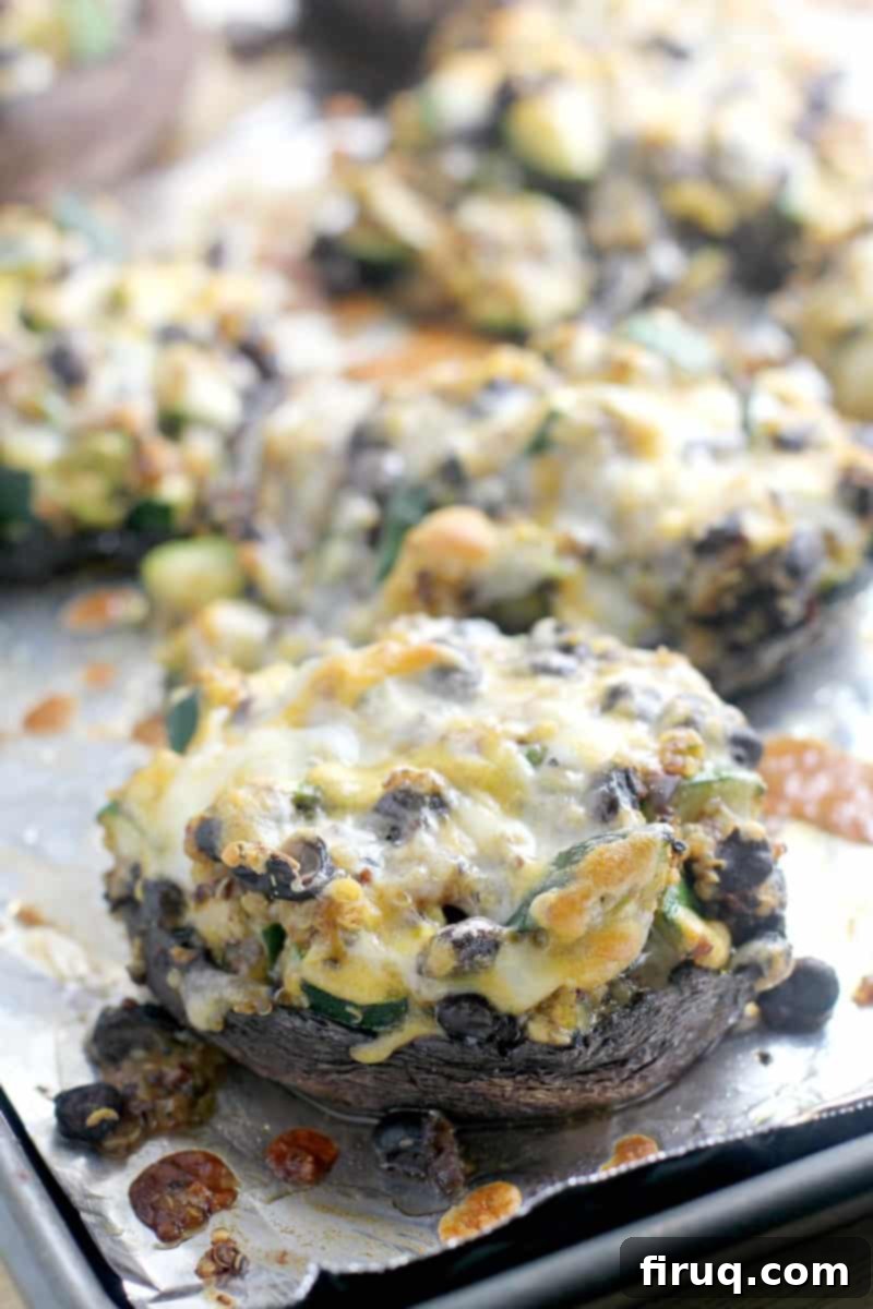 Zesty Mexican Quinoa Portobello Boats 8 cooked, cheesy stuffed mushrooms on the bake sheet