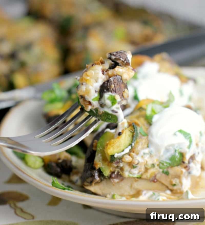 Zesty Mexican Quinoa Portobello Boats 10 fork scooping a bite of stuffed mushroom