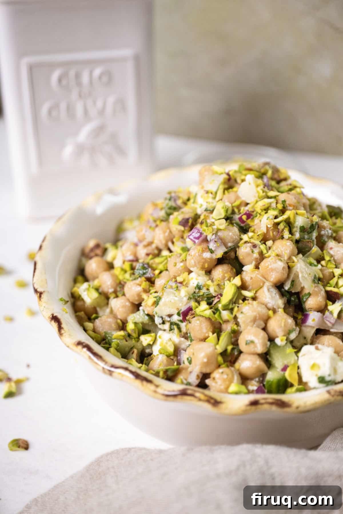 Mediterranean Chickpea Feta Salad 2 Chickpea and feta salad in a bowl topped with pistachios